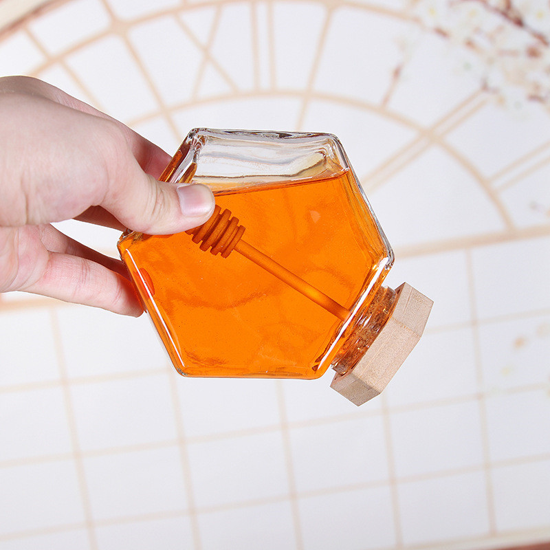 Best quality 100ml 220ml 380ml hexgnal glass honey jar with wooden lid