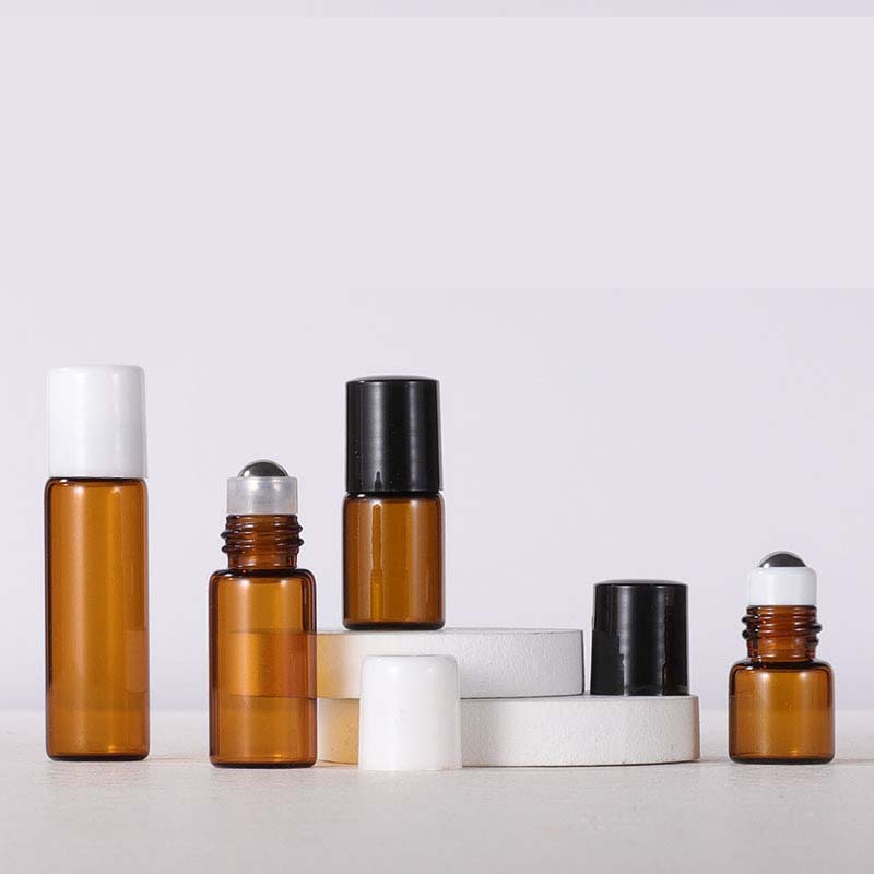 Best seller 1ml 2ml amber/clear colorful essential oil sample traveling glass bottle small brown sample bottle with steel roller