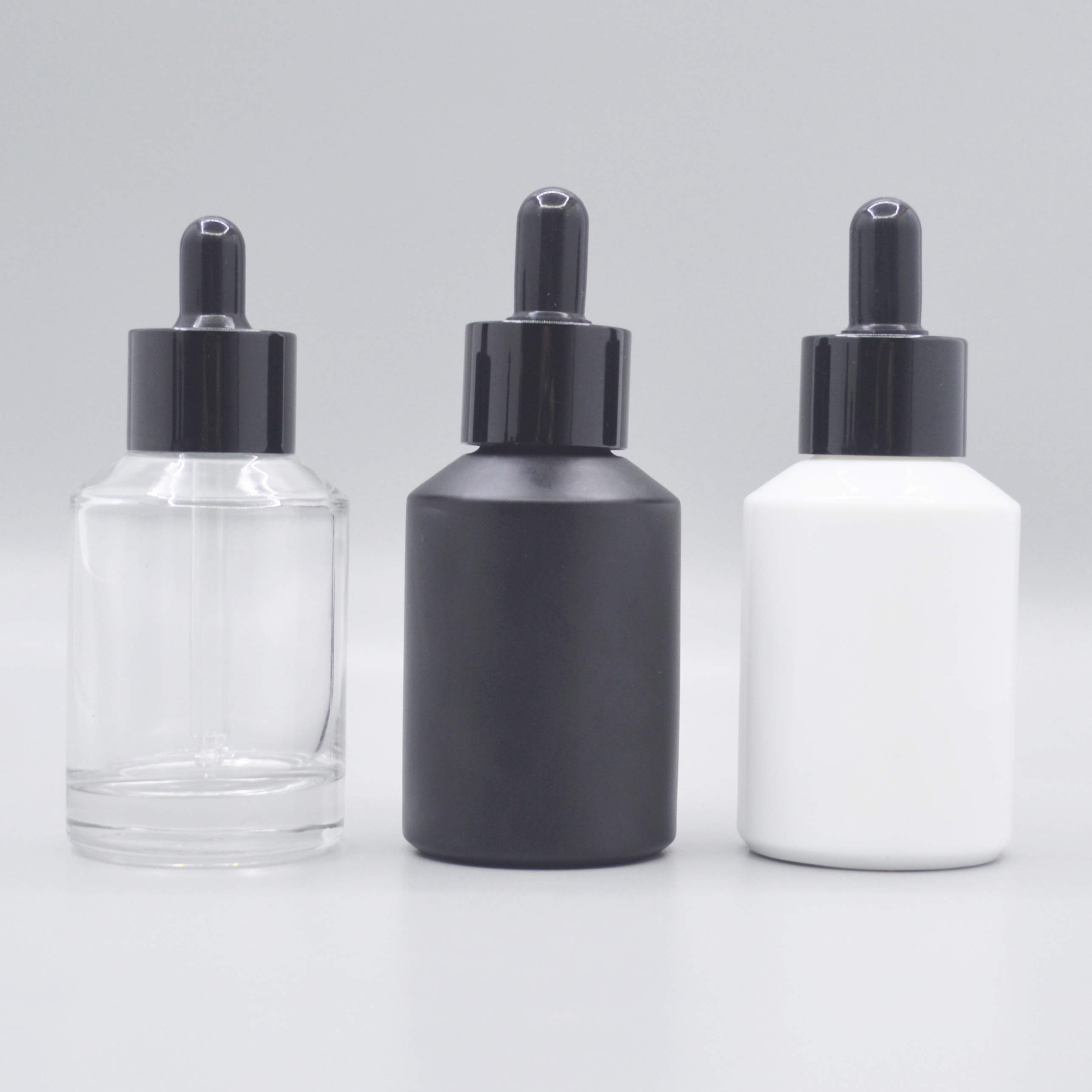 Black Oblique Cosmetic Glass Bottle and Glass Jar with Black Lid and Pump