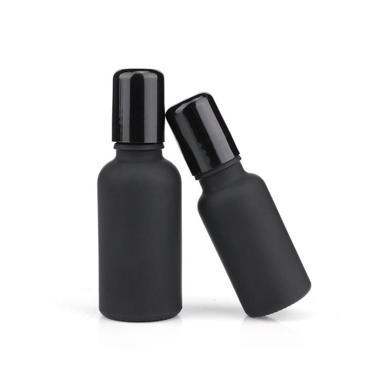 Black glass bottle with mental roll on for cosmetic packaging