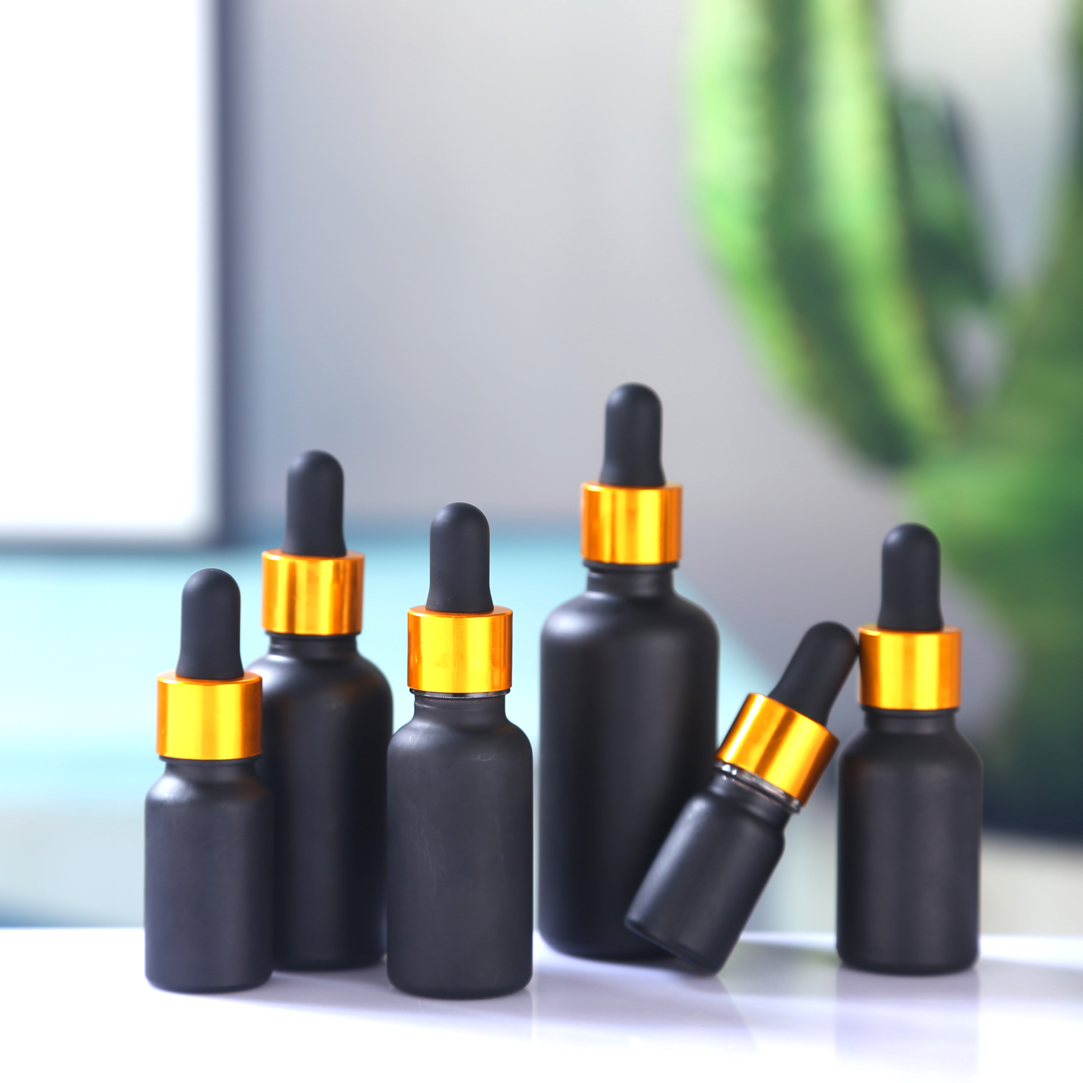 Bottle for sale luxury cosmetic packaging 1oz gold serum dropper bottle matte frosted black glass bottles with gold aluminum cap