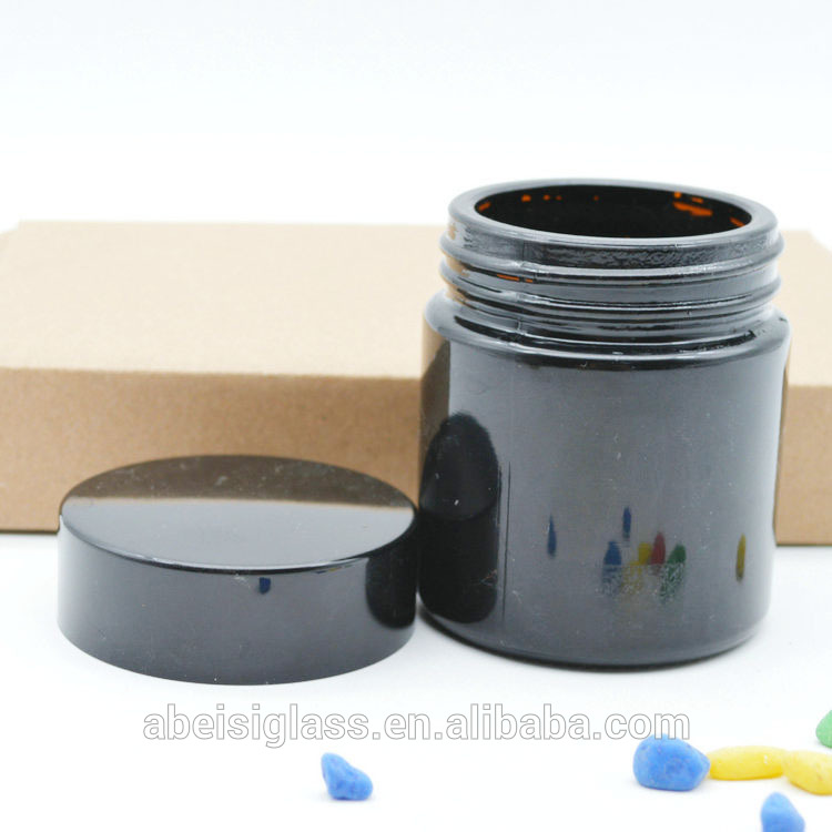 Bright black glass cream jar
