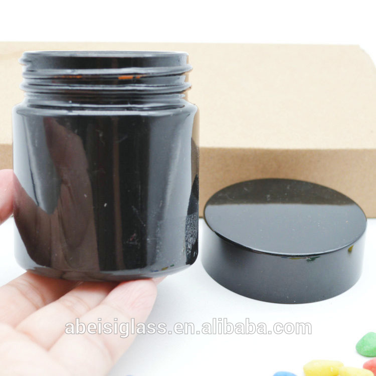 Bright black glass cream jar