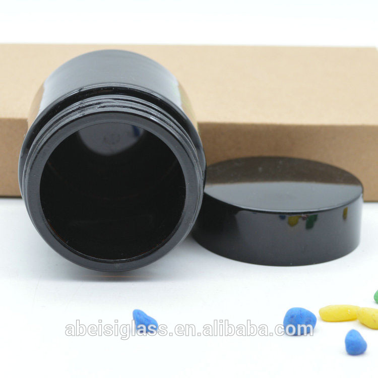 Bright black glass cream jar