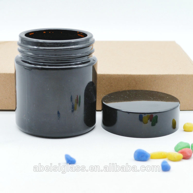 Bright black glass cream jar