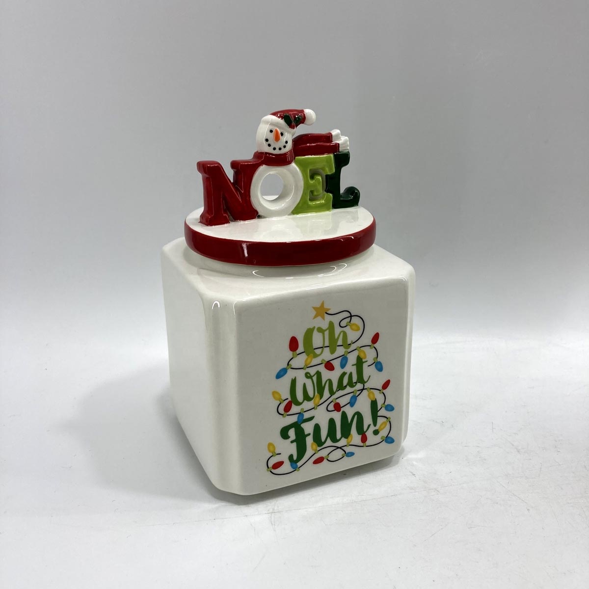 Ceramic storage jar with snowman lid