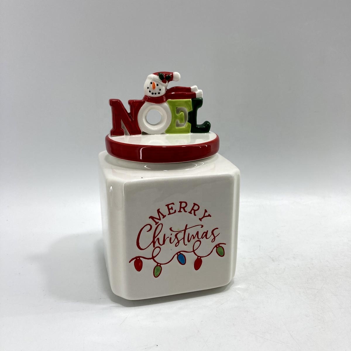 Ceramic storage jar with snowman lid