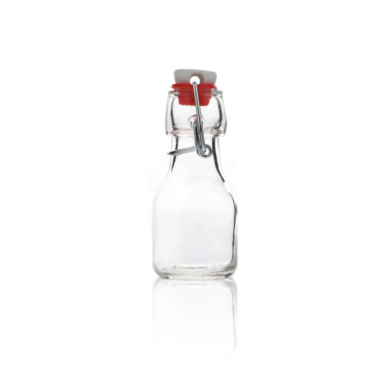 Cheap Round 60 ml 2oz Empty Glass Bottles With Caps Beverage Juice Bottle