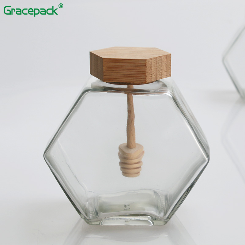 Cheap hot sale 220ml 320ml empty hexagon glass honey jar with wooden lid, honey bee jar