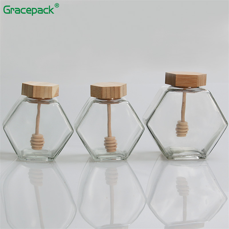 Cheap hot sale 220ml 320ml empty hexagon glass honey jar with wooden lid, honey bee jar