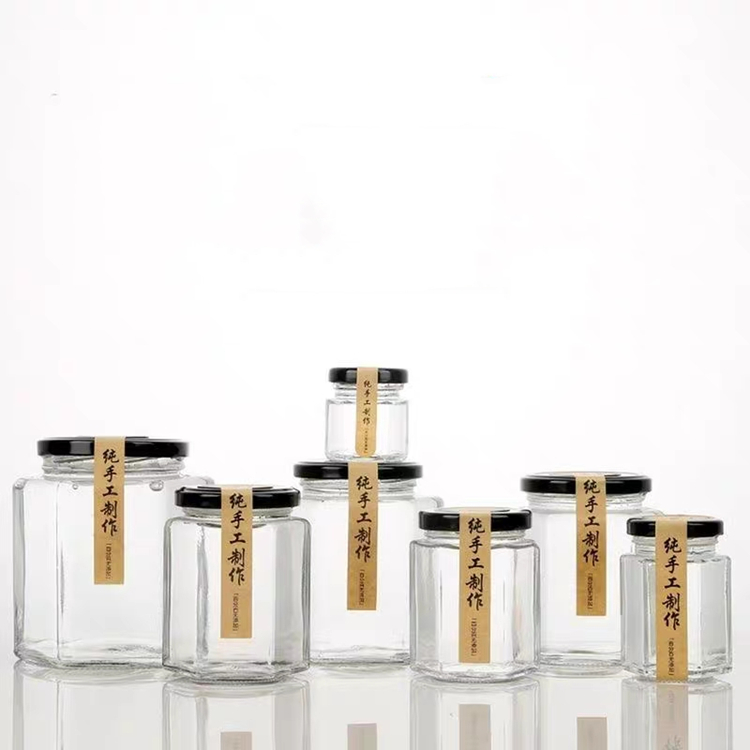 Cheap price 730ml 500ml 380ml 280ml 180ml hexagonal glass storage jar with metal lids wholesale