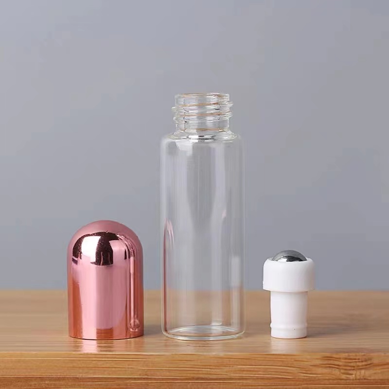 China Factory 1ml 2ml 3ml 5ml Mini Clear Color Glass Roll On Bottle Essential Oil Bottle Metal Roller Ball Rose Gold Perfume