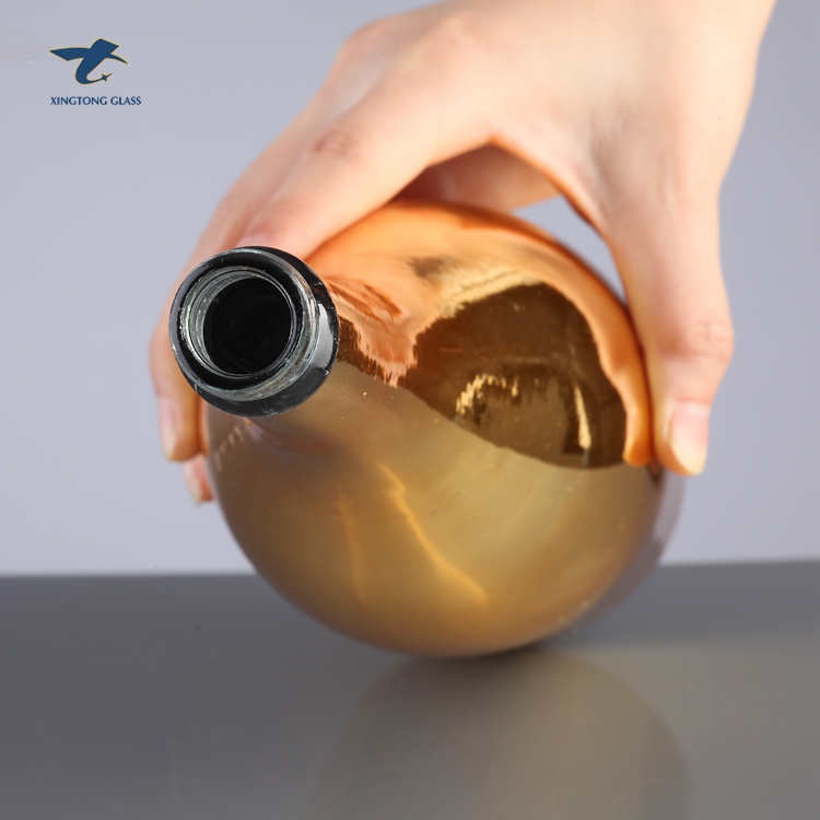 China Factory Custom Gold Champagne Glass Bottles With Plastic Cap