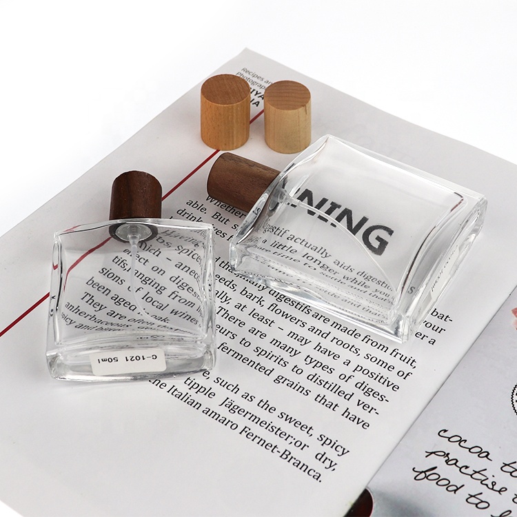 China Manufacture Wooden Caps Luxury Glass Perfume Bottle 50ml 100ml Perfume Glass Bottle