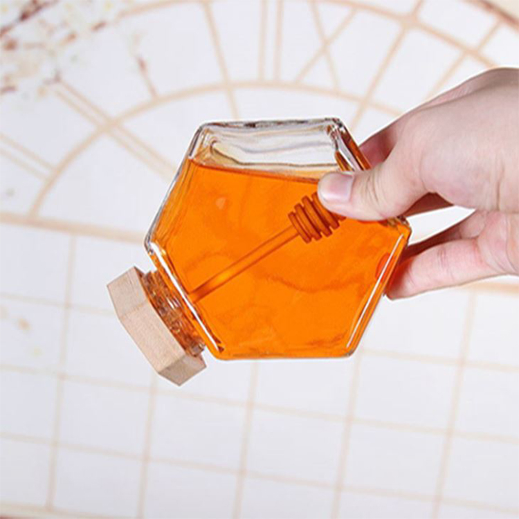 China RTCO Manufacturer 100ml 220ml 380ml 500g Transparent Glass Honey Jar Jam Bottle With Wooden Lid Hexagon Honey Container