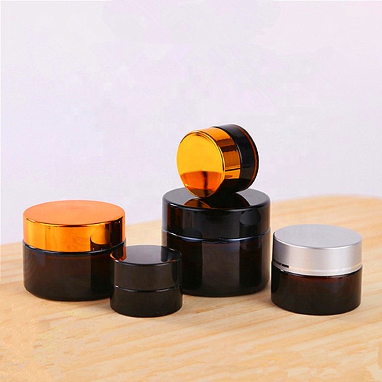 China best supplier pretty round brown glass jars 2oz glass jars with lids