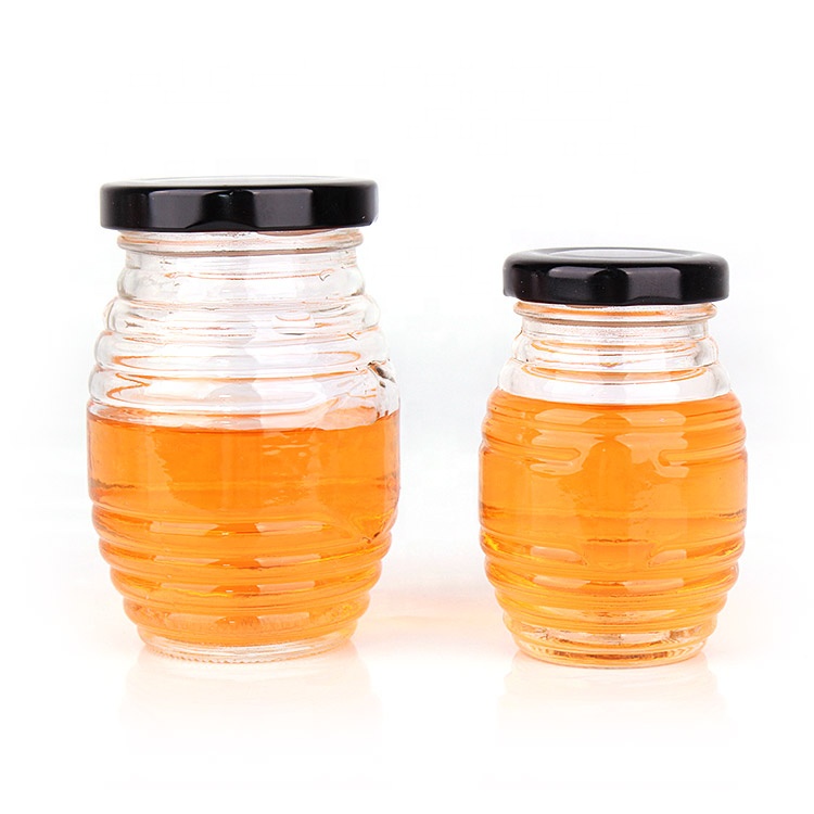 China factory empty unique 380ml clear honey glass jar with black metal lid