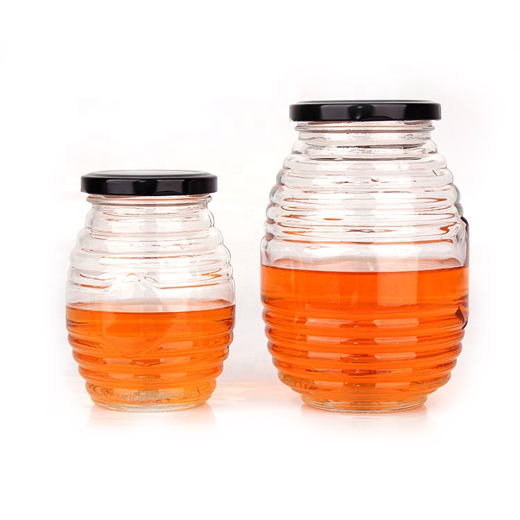 China factory empty unique 380ml clear honey glass jar with black metal lid