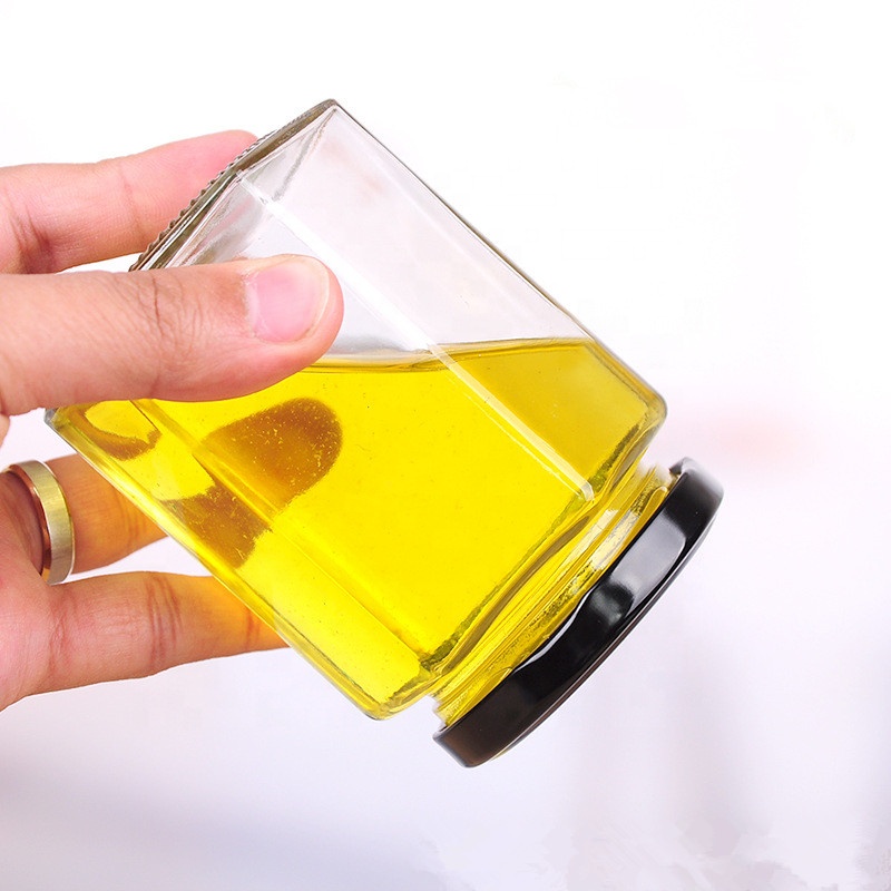 China manufacturers wholesale 500gm 500 ml 730ml 1kg hexagonal honey glass containers jars with lids