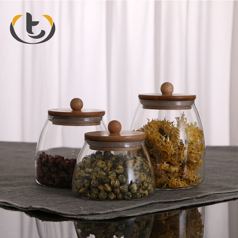 China supply for sale borocilicate glass jar with wooden lid and spoon slant glass jar