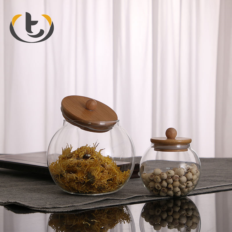 China supply for sale hermetic pumpkin glass jar with lid high borosilicate glass storage jar