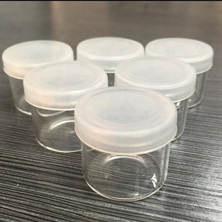 China wholesale price Borosilicate concentrate jars for CBD cream 6ml glass jar concentrate with soft silicone lid