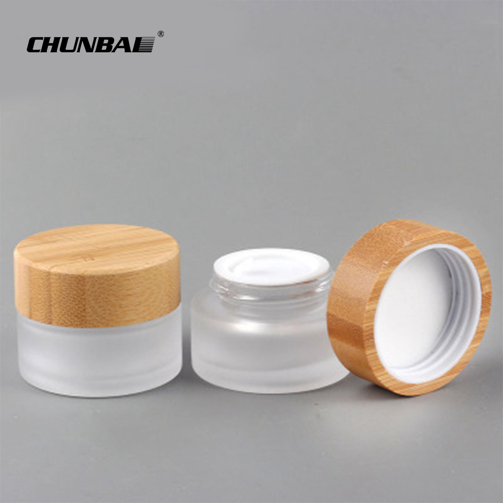 Chunbai 1oz 2oz 3oz 4oz 5oz 6oz CBD glass jar containers bamboo cream jar frosted glass jar with bamboo lid free sample