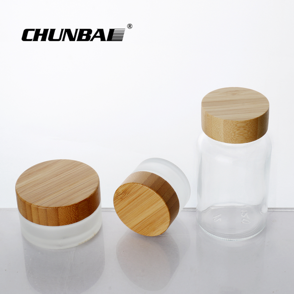 Chunbai 1oz 2oz 3oz 4oz 5oz 6oz CBD glass jar containers bamboo cream jar frosted glass jar with bamboo lid free sample