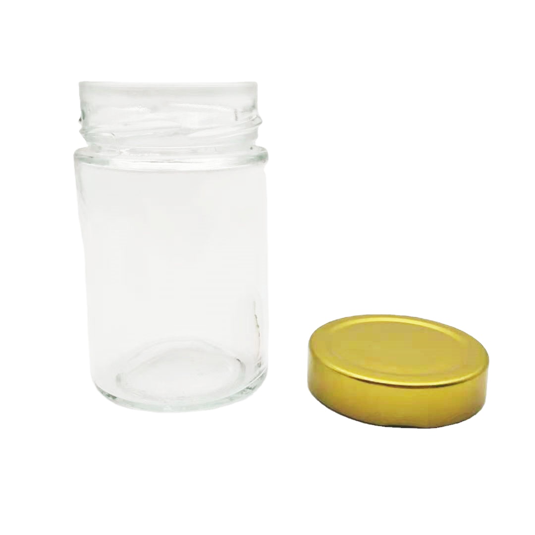 Clear 240ml cylindrical custom glass jars with high glod screw caps