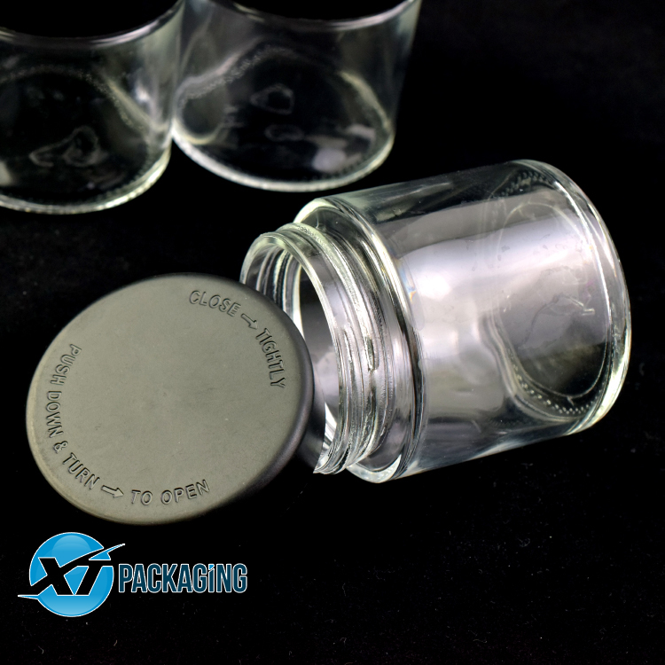 Clear child resistant clear glass cosmetic jar with Child proof lid