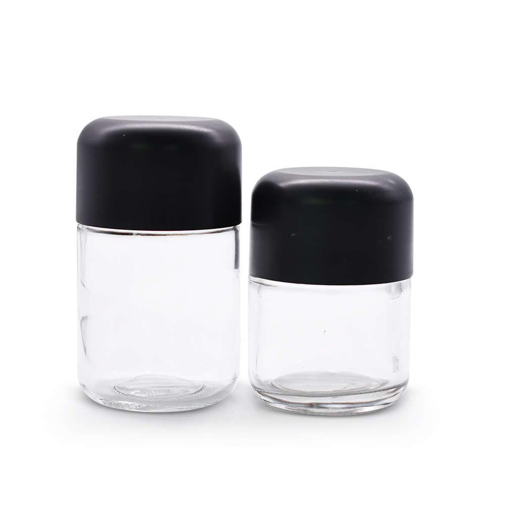 Clear glass jar with black child-proofing cap for Dry Herb Wax Thick Oil Concentrate