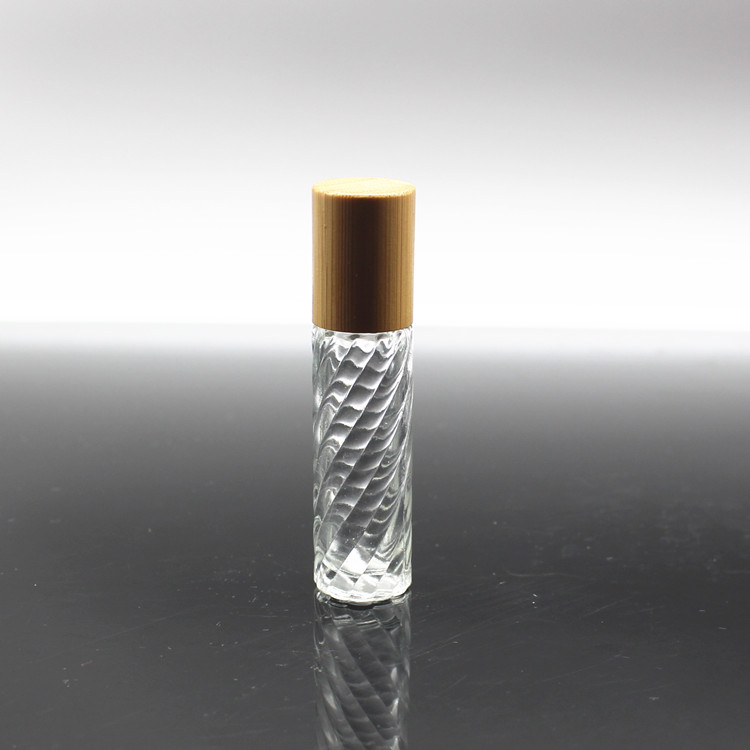 Clear glass roller perfume bottle with bamboo cap and metal roller