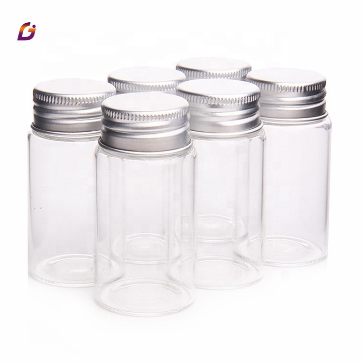 Clear glass saffron capsule pill bottle with aluminum cover
