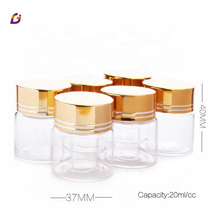 Clear glass saffron capsule pill bottle with aluminum cover