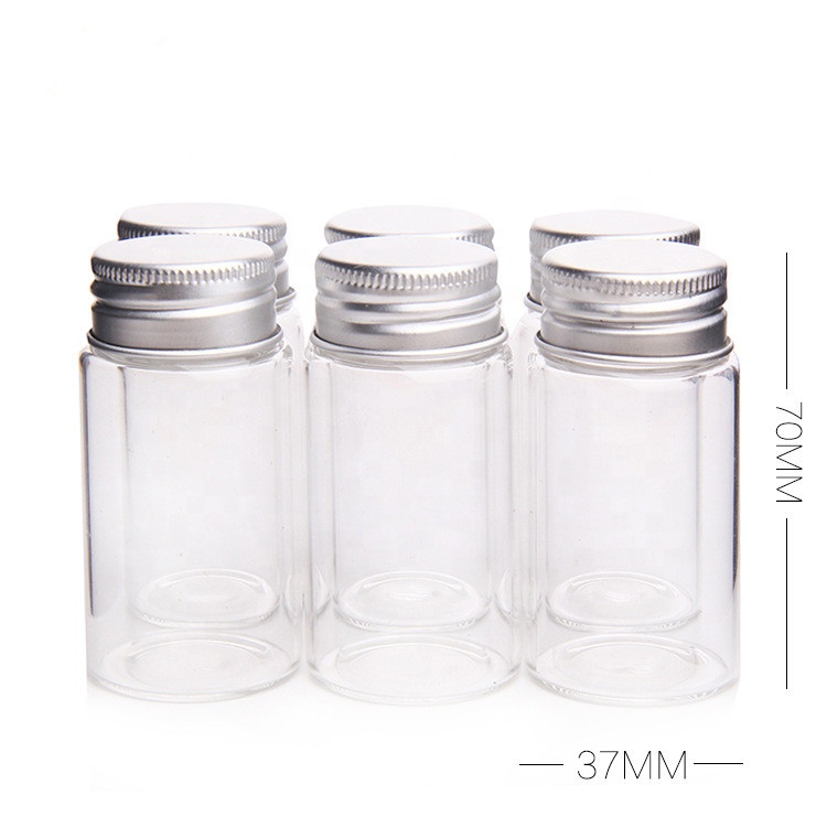Clear glass saffron capsule pill bottle with aluminum cover