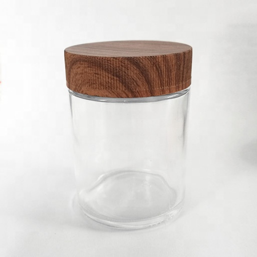 Clear gooq quality child resistant 2OZ  glass jar with plastic wooden lid