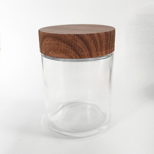 Clear gooq quality child resistant 2OZ glass jar with plastic wooden lid