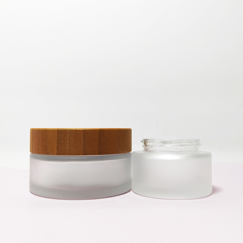 Clear personal care 10g 30g 50g 100g frosted clear glass cosmetic cream jar with bamboo wooden lid logo engraving