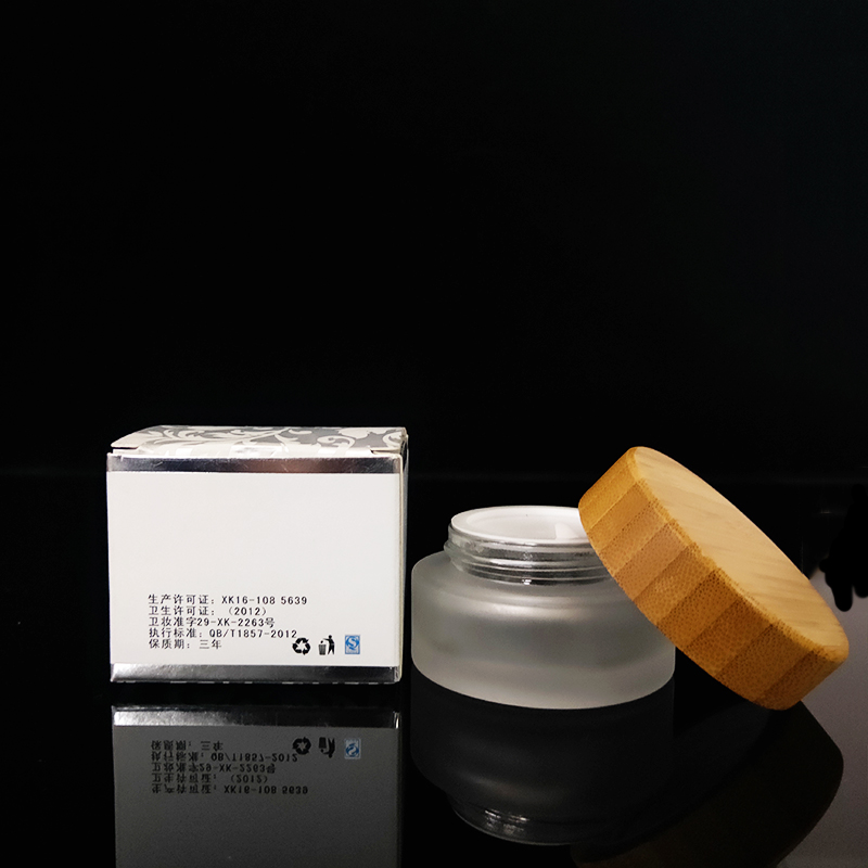 Clear personal care 10g 30g 50g 100g frosted clear glass cosmetic cream jar with bamboo wooden lid logo engraving