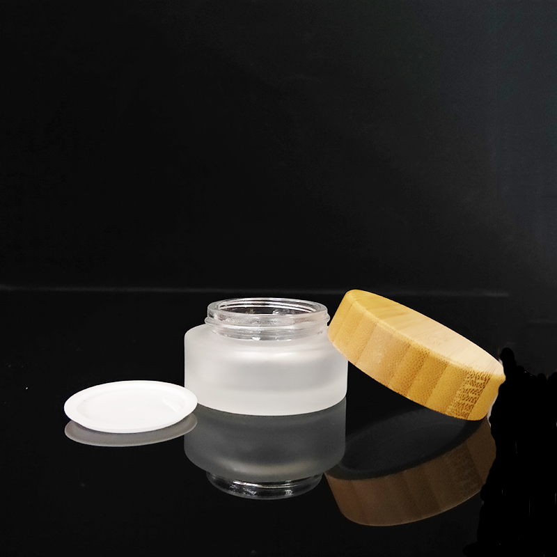 Clear personal care 10g 30g 50g 100g frosted clear glass cosmetic cream jar with bamboo wooden lid logo engraving