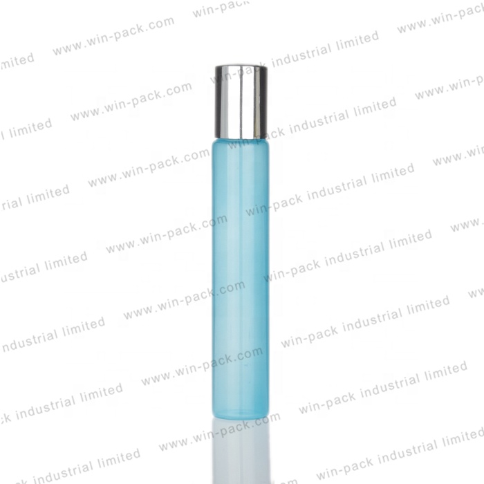 Clear tube glass roll on bottle with silver lid and white ball housing