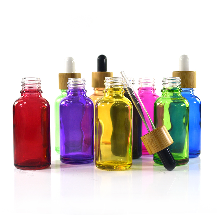 Colorful cosmetic essential oil packaging 30ml clear glass dropper bottle with bamboo cap
