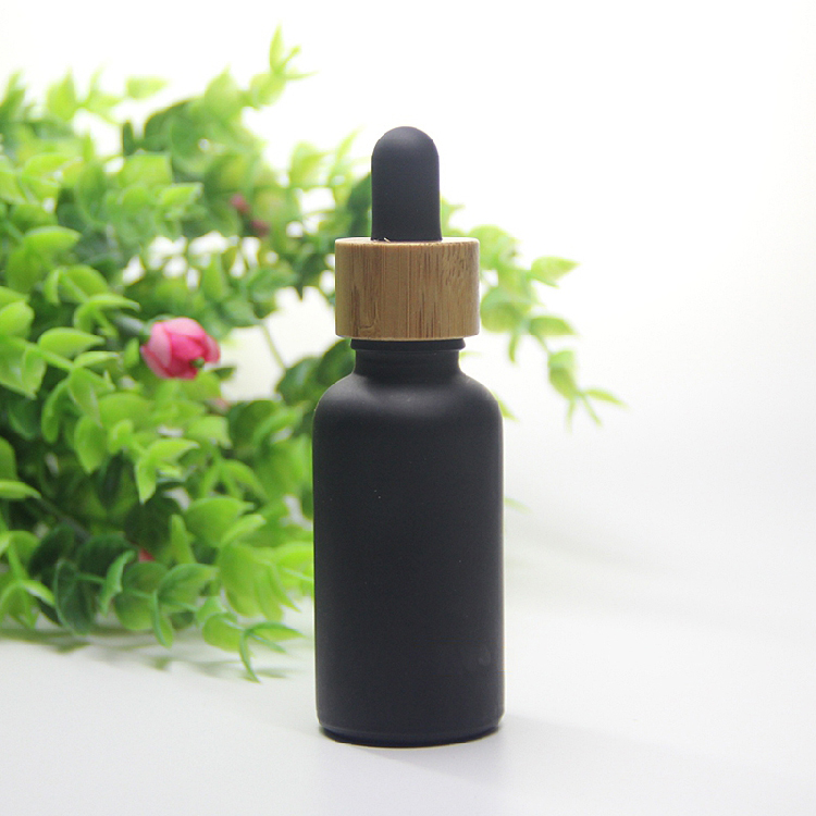 Cosmetic 15ml 20ml essential oil bottle matte black frosted glass bamboo dropper bottle with bamboo cap