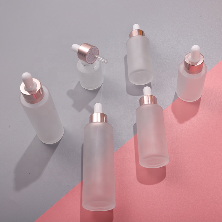 Cosmetic 30ml 40ml 50ml clear frosted flat shoulder essential oil glass bottle with rose gold dropper lid