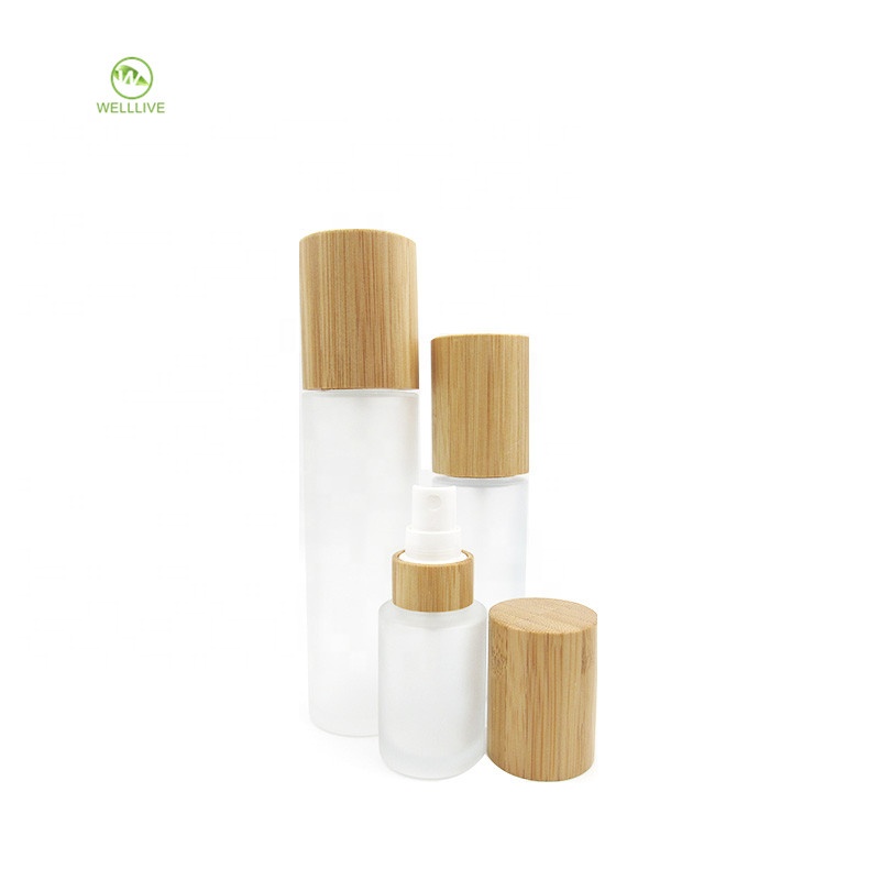 Cosmetic bamboo serum packaging 50ml 60ml 2oz glass frosted clear perfume pump sprayer bottle with atomizer