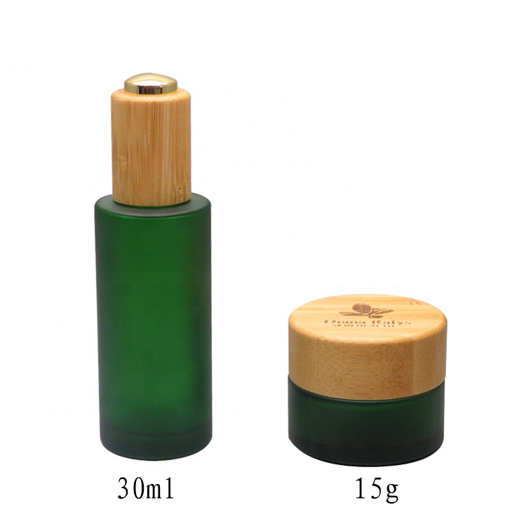 Cosmetic oil bottle green frosted 1oz 30ml flat shoulder glass bottle with bamboo pump cap