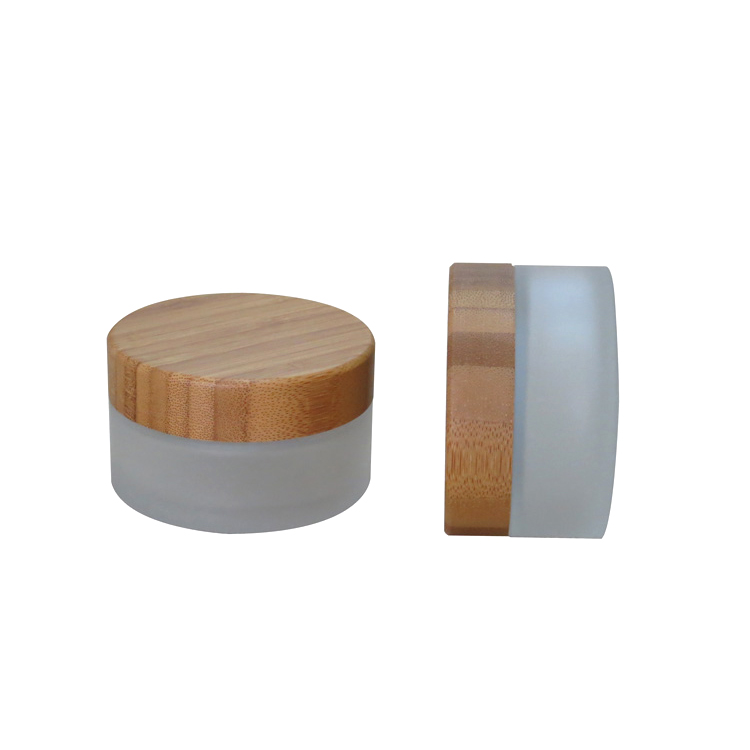 Cosmetic packaging 15g 30g 50g 100g 1 oz clear frosted glass jar with logo printing and gold or silver lids bamboo lids