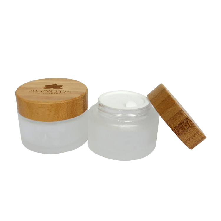 Cosmetic packaging 15g 30g 50g 100g 1 oz clear frosted glass jar with logo printing and gold or silver lids bamboo lids