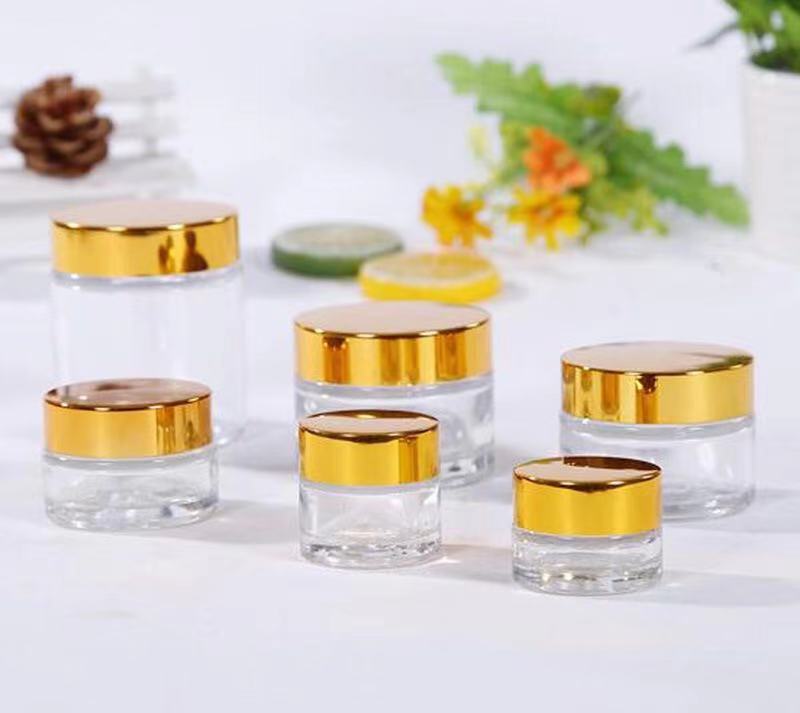 Cosmetic packaging 1oz 2oz 5g10g15g 30g 50g 100g glass cream cosmetic jar with Metallic plasticslid