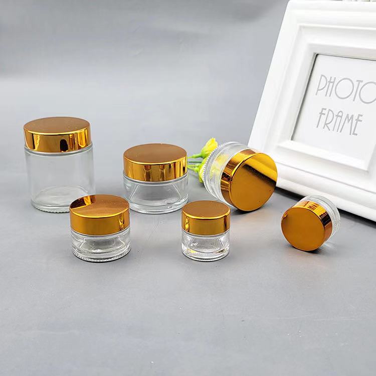Cosmetic packaging 1oz 2oz 5g10g15g 30g 50g 100g glass cream cosmetic jar with Metallic plasticslid